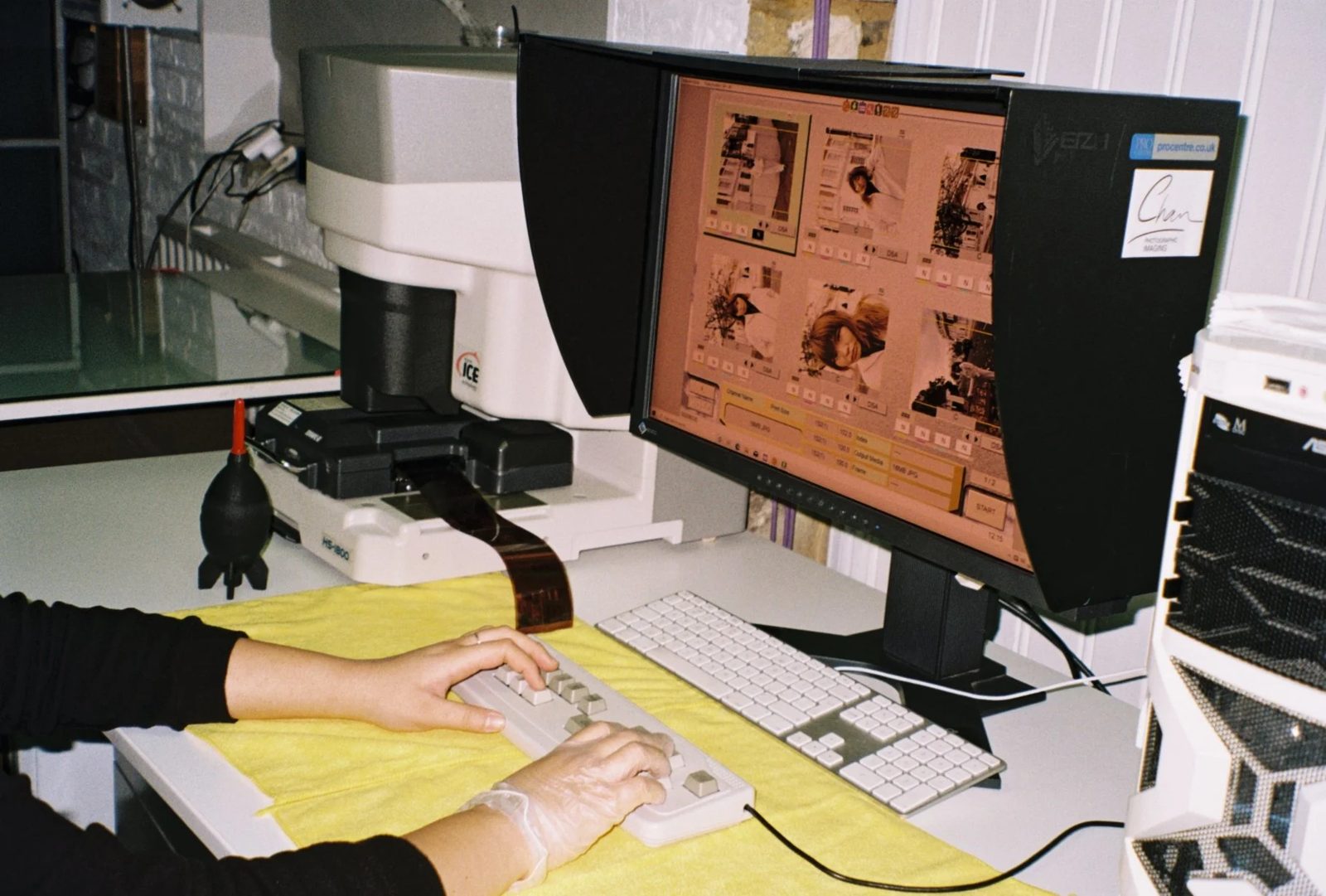 Scanning a roll of film on the Noritsu scanner at Chan Photo Lab